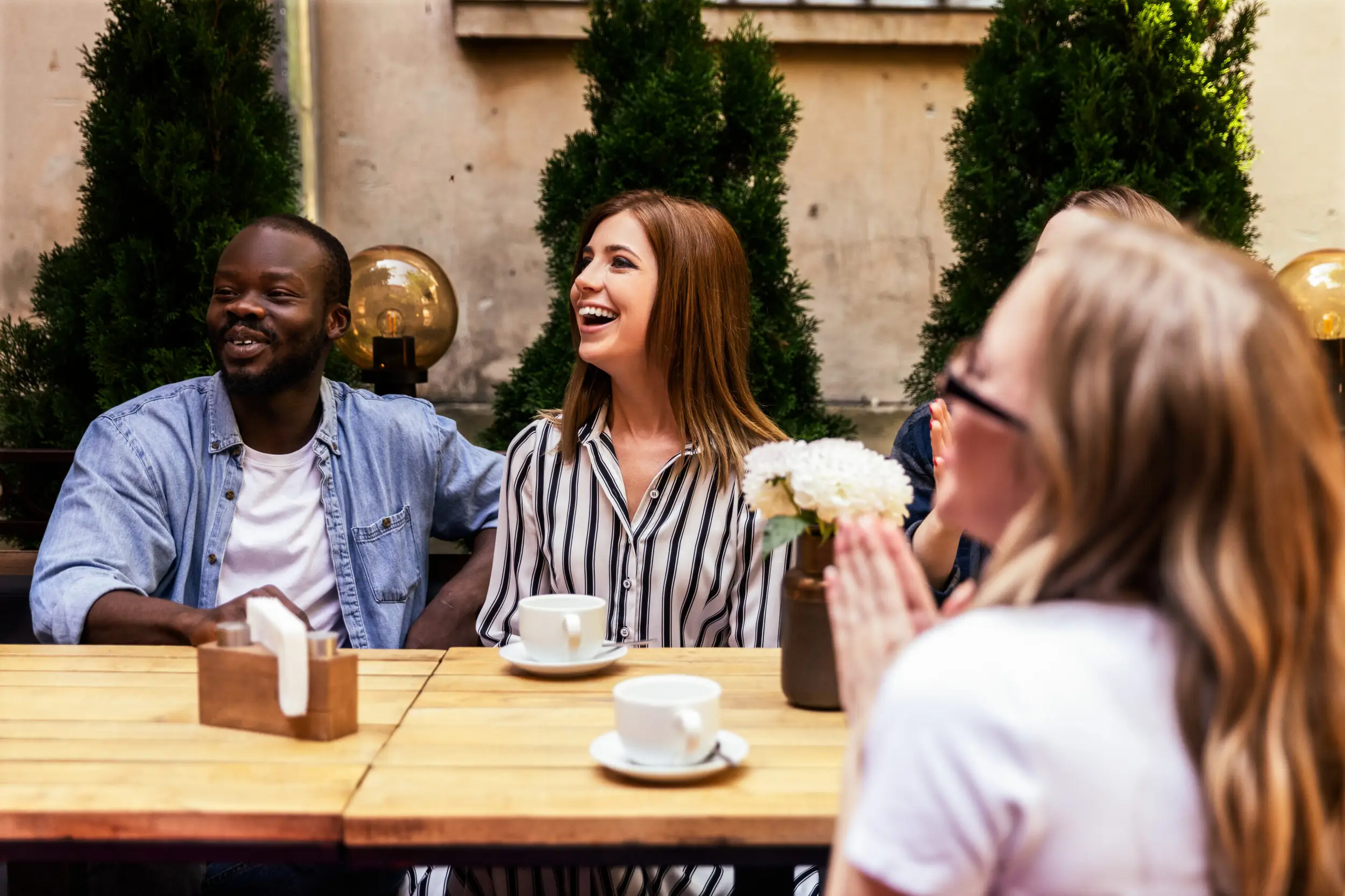 A group of people demonstrating a positive reception to a marketing presentation, highlighting that tailored marketing PowerPoint designs successfully capture the audience’s attention