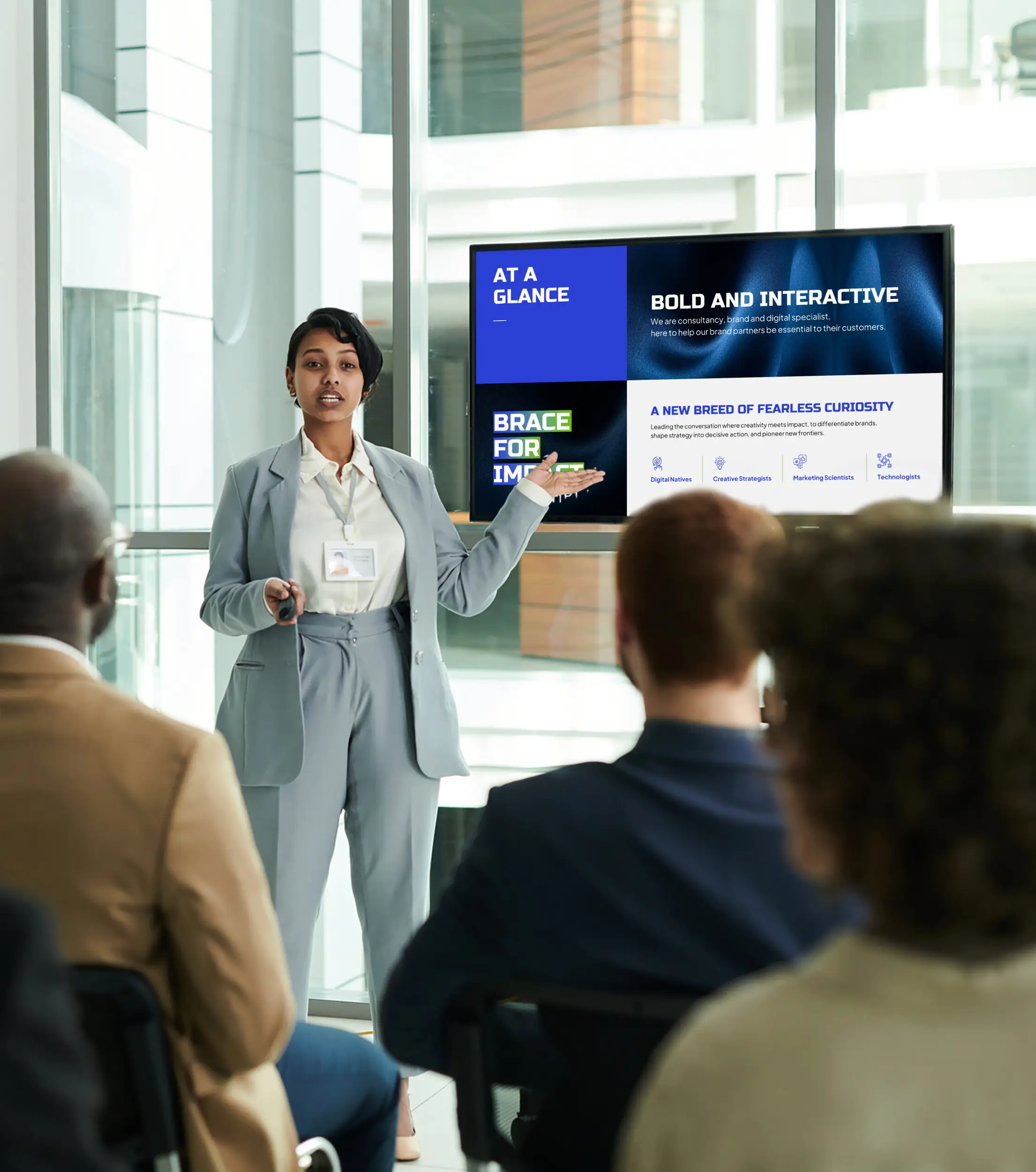 A presenter delivers a bold and interactive corporate strategy deck, exemplifying high-impact presentation design services that clarify complex messaging and engage professional audiences.